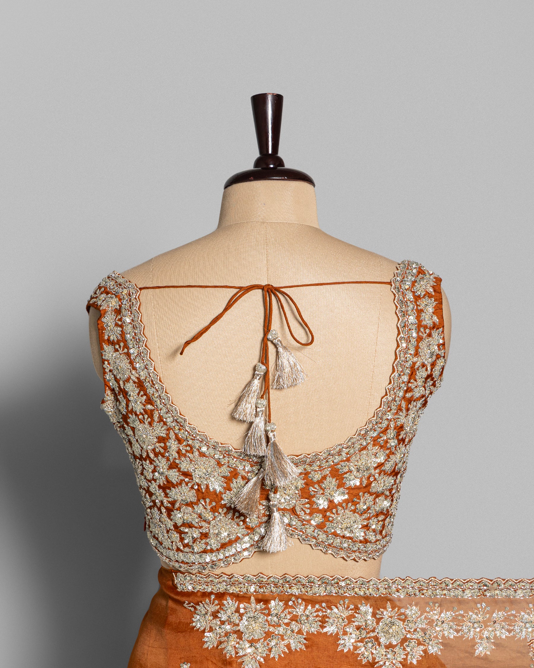 BURNT ORANGE DESIGNER ORGANZA SAREE WITH EMBROIDERED BORDER