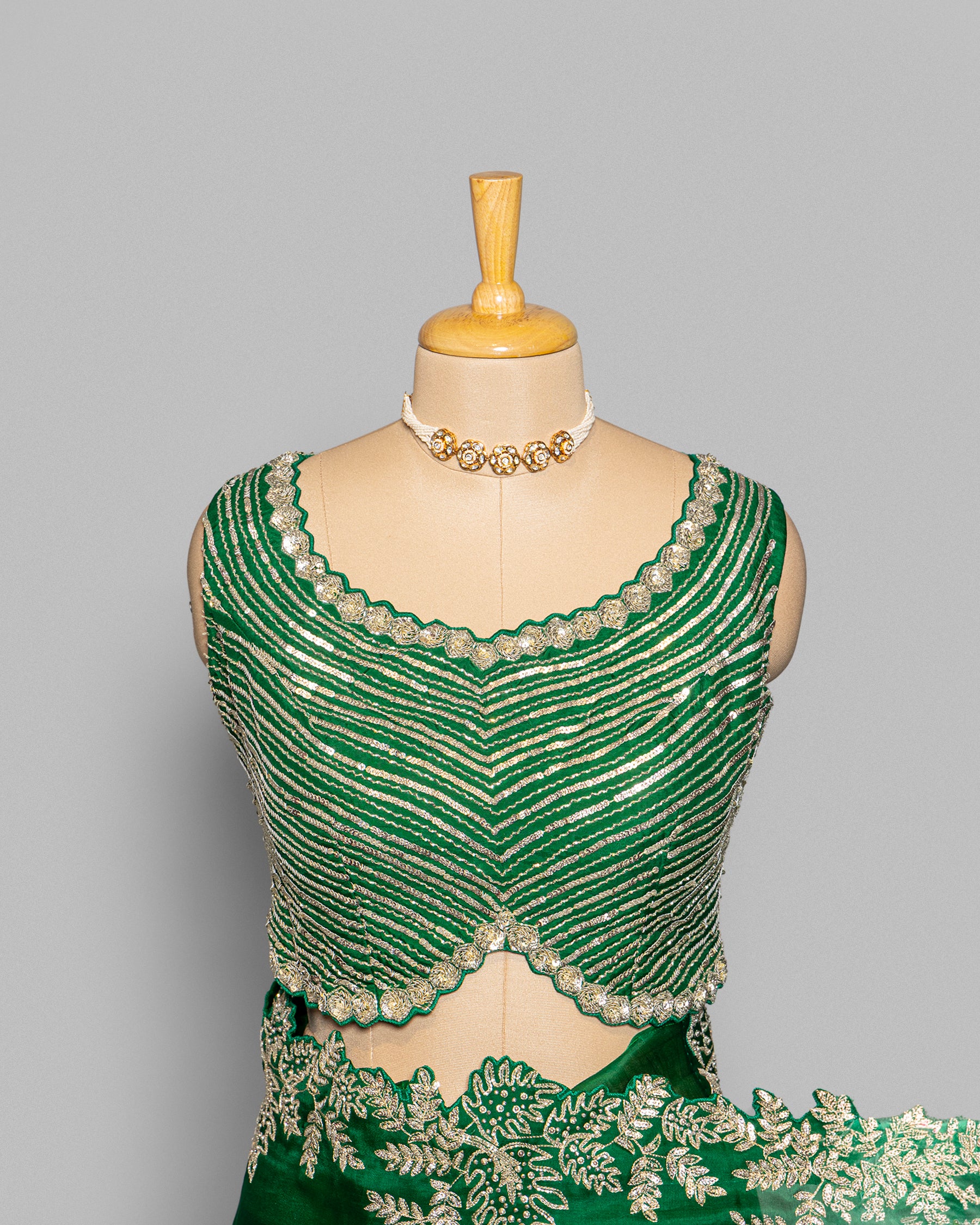 EMERALD GREEN ORGANZA SAREE WITH LEAF EMBROIDERED BORDER